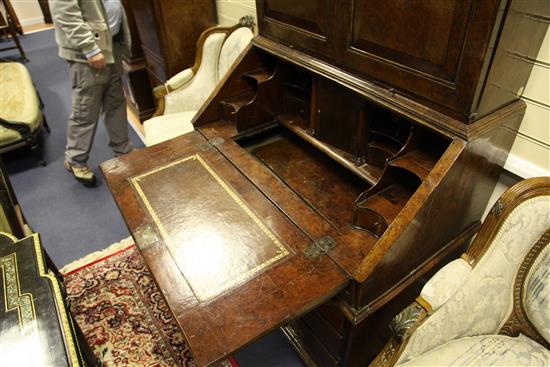 A Queen Anne walnut and featherbanded bureau cabinet, W.3ft 5in.